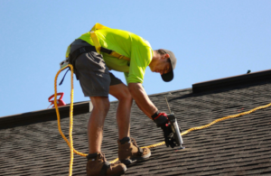 A man working for roof cleaning